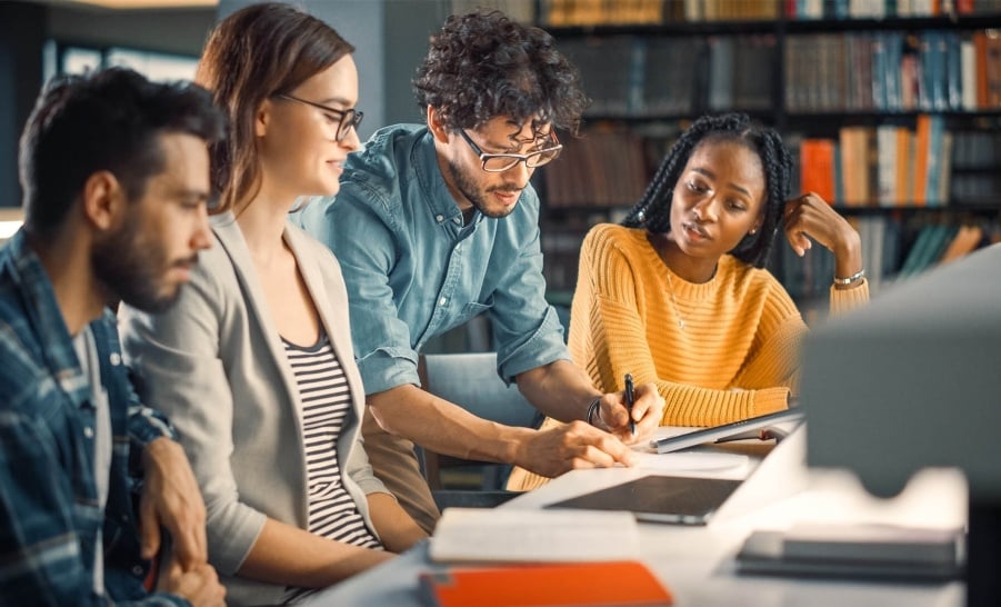 College students working on a project together